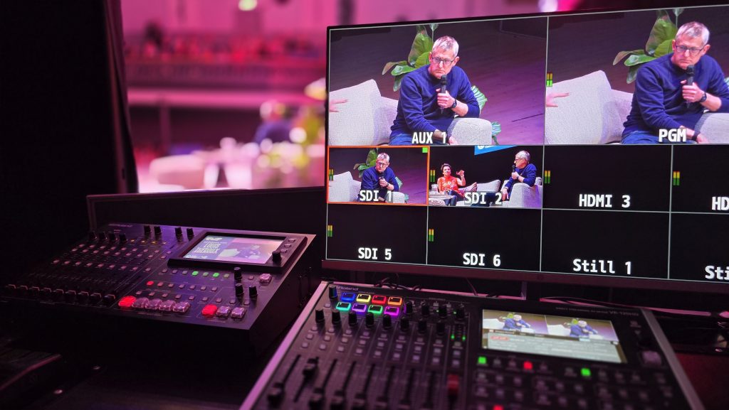 Behind-the-scenes AV production for Ultimate Masterclass Festival with technicians managing visuals and audio